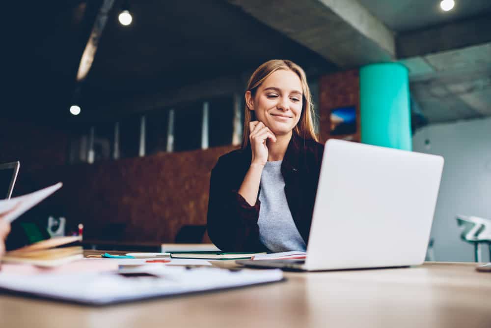 Woman looking at a laptop.